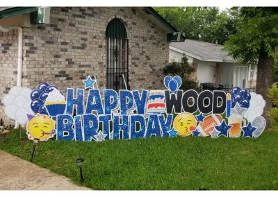 Lawn Sign Letters: Happy Birthday (Bright blue sparkles); Wood (Black); Lawn Sign Graphics: WHite and bright blue balloons light grey and blue sparkly stars, happy party face emoji, happy kiss face emoji, football, mug of beer and two tiered cake in red and blue